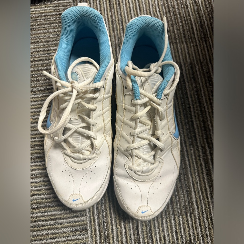 Women’s 8.5 NIKE leather tennis shoes, white with robins egg blue trim